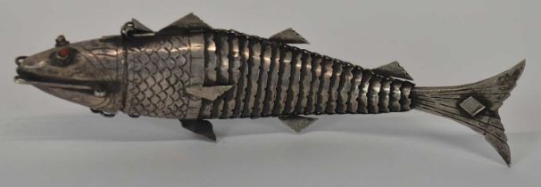 JUDAICA; a white metal spice box modelled as an articulated fish, length 17cm, approx. 2.5ozt/80g.