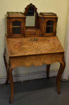 A Victorian walnut and marquetry inlaid bureau in the French style, the upper section with central