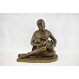 A large Indian bronze figure of a mother breastfeeding her child, height 50cm, width 50cm.