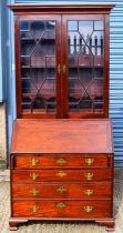 A 19th century mahogany bureau bookcase, the upper section with pair of astragal glazed doors