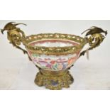 A circa 1800 Chinese Export Famille Rose porcelain bowl set in an elaborate gilt metal frame,