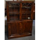 A 19th century mahogany bookcase with pair of glazed doors above pair of cupboard doors, width 113.