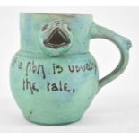 BARON BARNSTAPLE; a novelty fish jug inscribed 'The largest part of a fish is usually the tale",