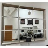 A large modern nine section wall mirror, each section measuring 90 x 65cm.