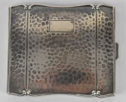 A Continental 835 grade hammered silver cigarette case, 9 x 7.5cm, 3.45ozt/107g.