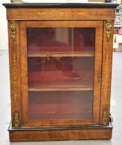 A Victorian walnut inlaid and gilt metal mounted pier cabinet with glazed door and plinth base,