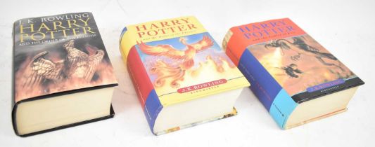 A group of three Harry Potter books, one first edition (3).