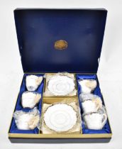 COALPORT; a blue and gilt decorated set of six teacups and saucers (cased).