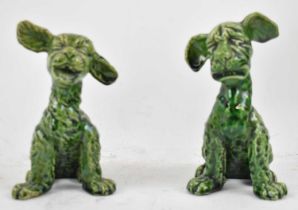 ALLERDALE OF DEVON; two green glazed pottery models of humorous dogs, both with impressed marks,