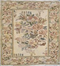 A modern floral decorated beige ground carpet, 185 x 124cm.