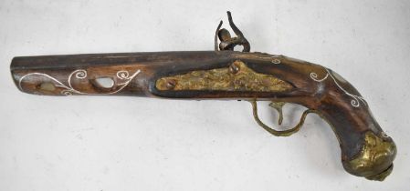 A distressed flintlock pistol with mother of pearl inlaid detail, af, length 31cm.
