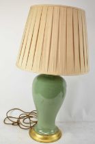 A contemporary Chinese celadon glazed baluster table lamp with shade, height including shade 81cm.