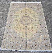 A fine Persian hand knotted woollen Kashan cream ground carpet, 212 x 140cm.