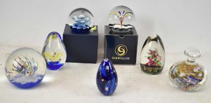 A group of seven decorative paperweights including Selkirk glass and others (7).