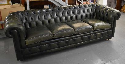 A large green leather button upholstered four seater Chesterfield sofa, width approx. 240cm.