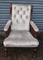 A 19th century oak framed elbow chair.