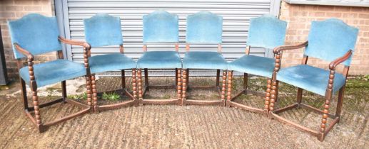 A set of six early 20th century oak dining chairs with bobbin turned supports, comprising two