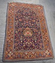 A red ground floral decorated carpet, 202 x 136cm.