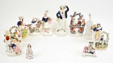 A collection of eleven assorted Staffordshire figures, mainly flatbacks.