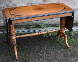A circa 1900 walnut inlaid crossbanded and ebonised sofa table with exaggerated flaps and twin
