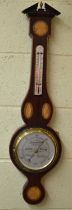 A reproduction mahogany and inlaid wheel barometer, height 86cm.