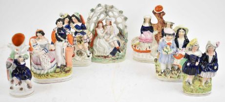 Seven assorted Staffordshire flatback figures.
