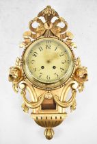 A mid 20th century Swedish gilt cartel wall clock, height 50cm, lacking hands.