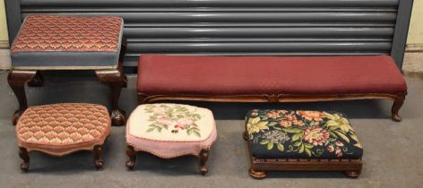 A group of five footstools, one with claw and ball feet, three with tapestry cushion covers etc. (