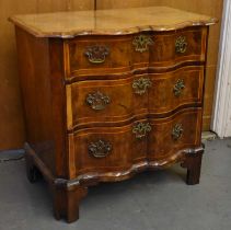 An 18th/19th century German walnut serpentine front three drawer chest, width 81cm.