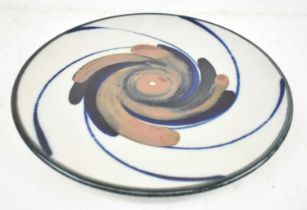 ARABIA; a Scandinavian ceramic charger with stylised decoration, diameter 29.5cm.