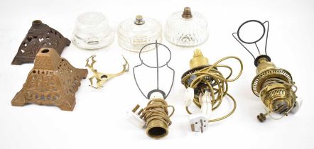 A quantity of oil lamp parts, to include three bases, two reservoirs, three burners, two large white