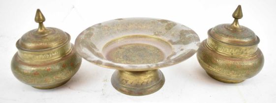 An Indian style brass footed dish, diameter 18cm, with two brass lidded pots, all with painted