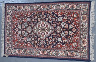 A Persian hand knotted carpet, 150 x 90cm.