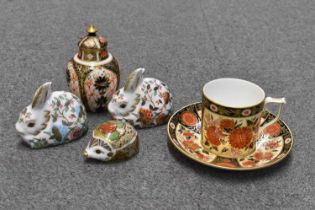 ROYAL CROWN DERBY; two paperwieghts modelled as rabbits and another as a hedgehog, also a