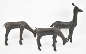 A group of three Moroccan damascene white metal deers, height of tallest 34.5cm.