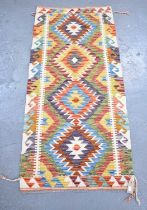 A handmade woollen Chobi Kilim runner, 153 x 67cm.