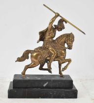 A brass model of a gladiator on horseback on stepped polished marble base, height 21.5cm.