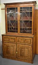 A Regency mahogany brass inlaid secretaire bookcase, the upper section with twin astragal glazed