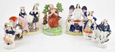 A collection of eight assorted Staffordshire figures including 'St Peter', height 21.5cm.