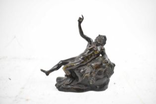 A 19th century bronze depicting Hercules lying upon the lion skin, length 14cm.
