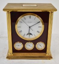 FRAN ROULET; a contemporary brass cased mantel clock with circular dial set with Roman numerals,