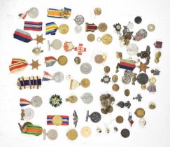 A group of various buttons, medals, cap badges etc.