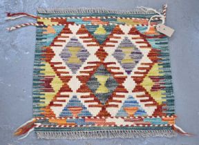 A small handmade woollen Chobi Kilim, 48 x 52cm.