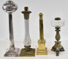 A group of four oil lamps, to include large silver plated example, height 60cm, brass oil lamp base,