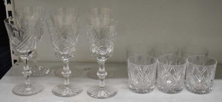 A set of six cut glass tumblers and matching set of six cut glass wine glasses.