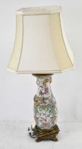 A 19th century Chinese Canton decorated porcelain table lamp on gilt metal mounts, height to top
