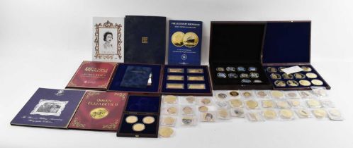 A large collection of cased and uncased commemorative gold plated coins including Royal