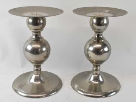 POLS POTTEN; a pair of modern stainless steel pricket candlesticks, height 39cm, diameter of top