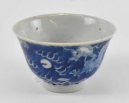 An early 20th century Japanese blue and white porcelain bowl decorated with two dragons chasing