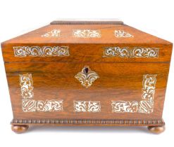 A George IV mother of pearl tea caddy of sarcophagus form, hinged cover enclosing fitted interior,